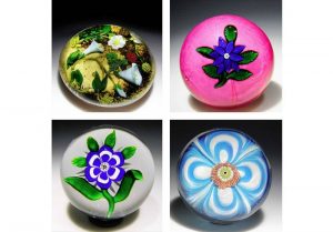 These four glass paperweights are indicative of the quality of about 400 paperweights currently at the Art Institute of Chicago that will be auctioned off to the public on Sept. 17. While some individual paperweights are expected to be worth five figures, bidding on groups of two to four begins at photo1,000.