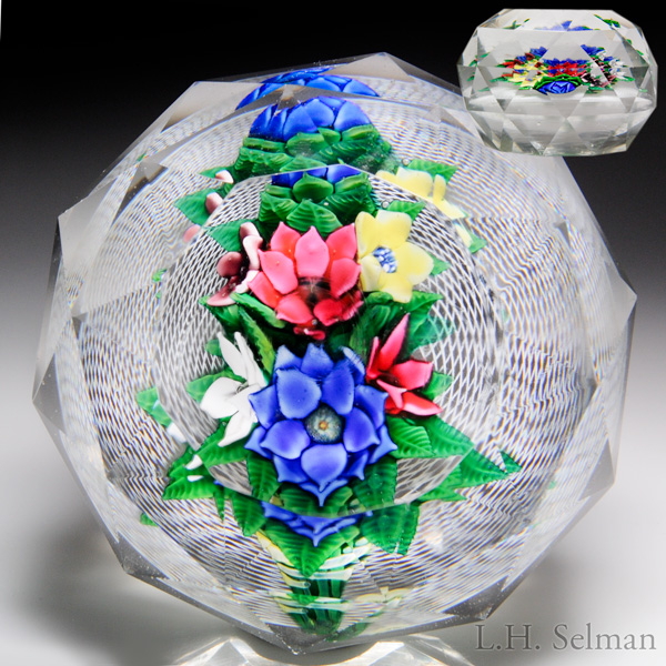 Extremely rare magnum antique New England Glass Company bouquet on latticinio faceted paperweight.