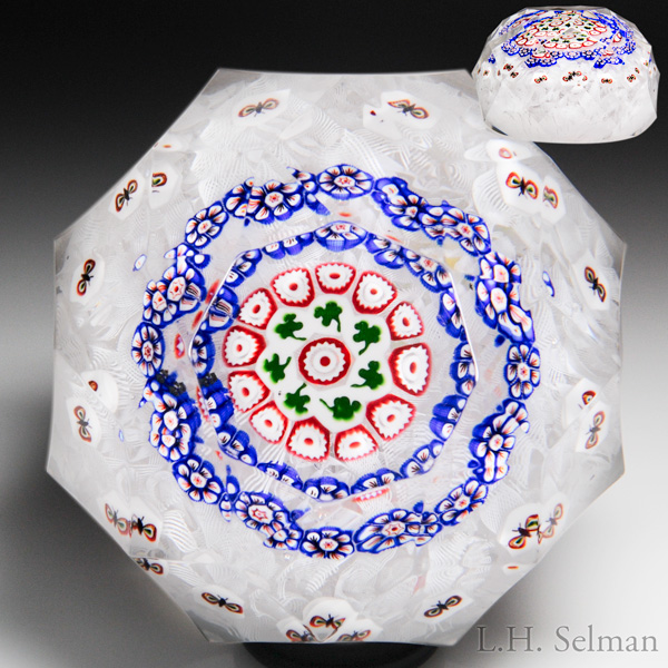 Rare Antique Baccarat concentric shamrock and butterfly millefiori on upset muslin faceted paperweight.